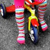 Happy Girl Riding on Rainbows Tricycle Free Creative Commons